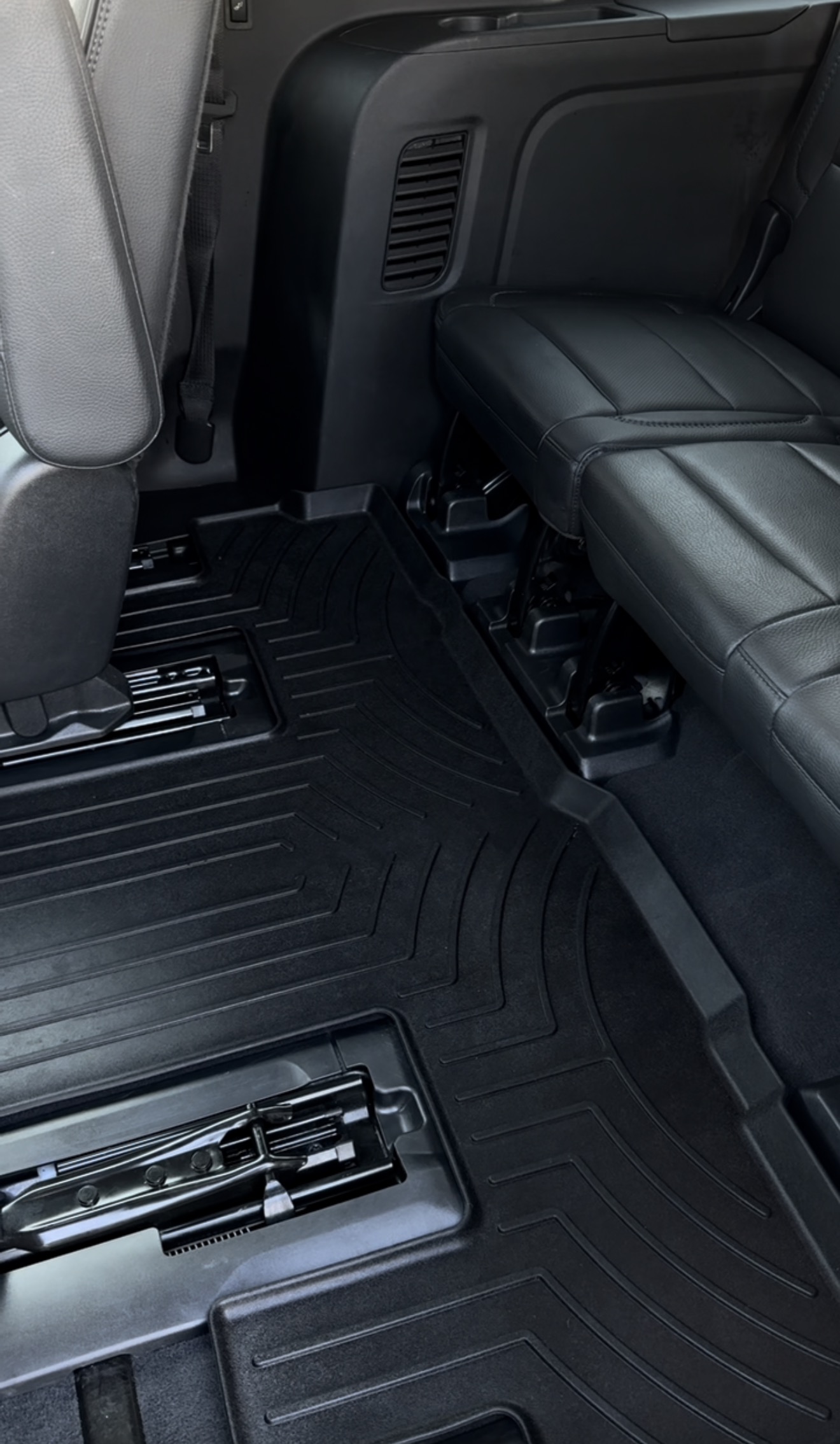 GMC Denali rear floor mat fully cleaned and vacuumed after a PRO DTLR PRO Reset