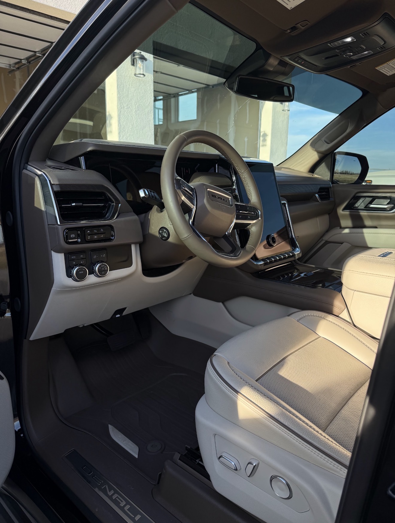 GMC Denali front seats and dashboard after an interior detail