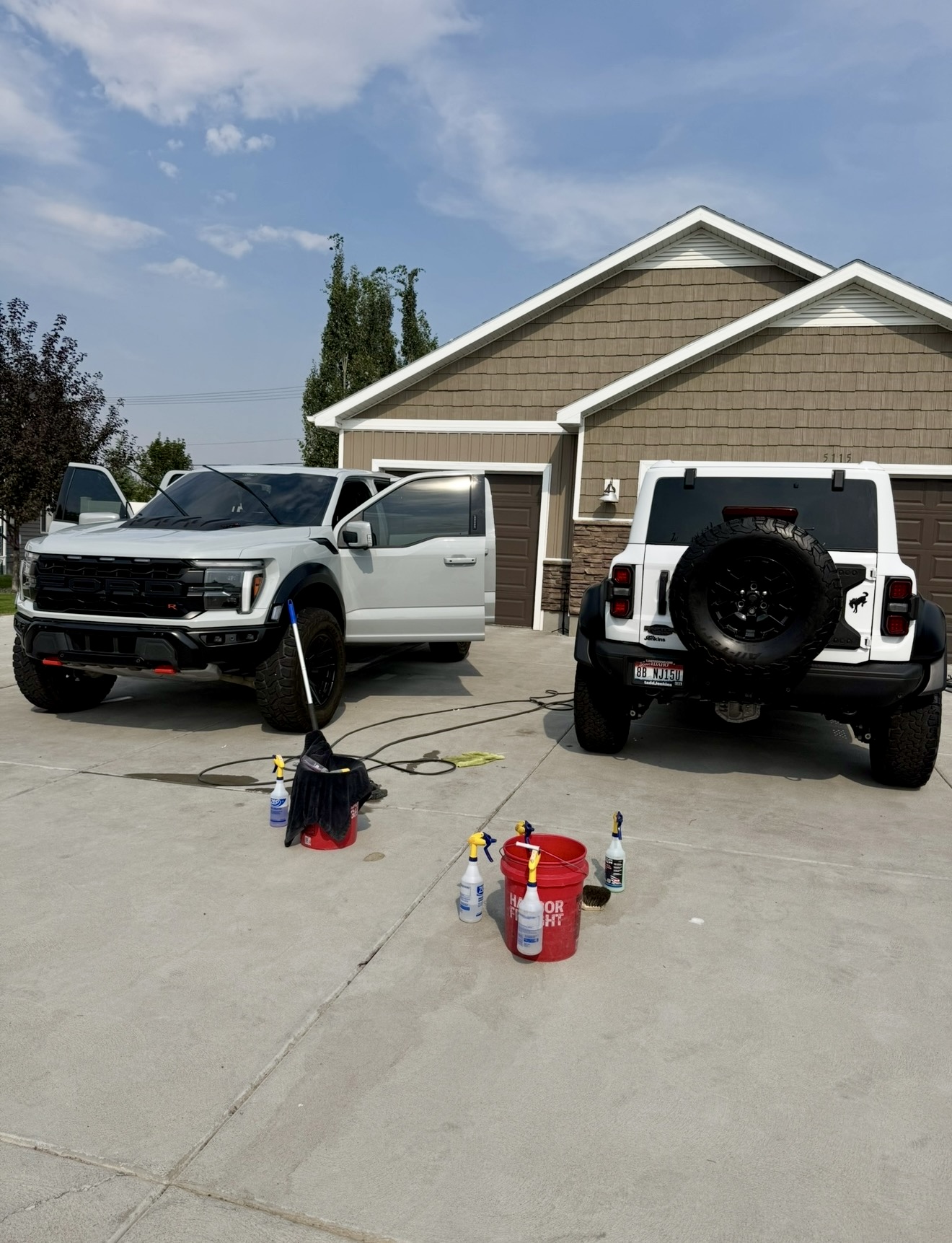 PRO DTLR mobile detailing setup with a truck and Jeep ready to service at a customer's home