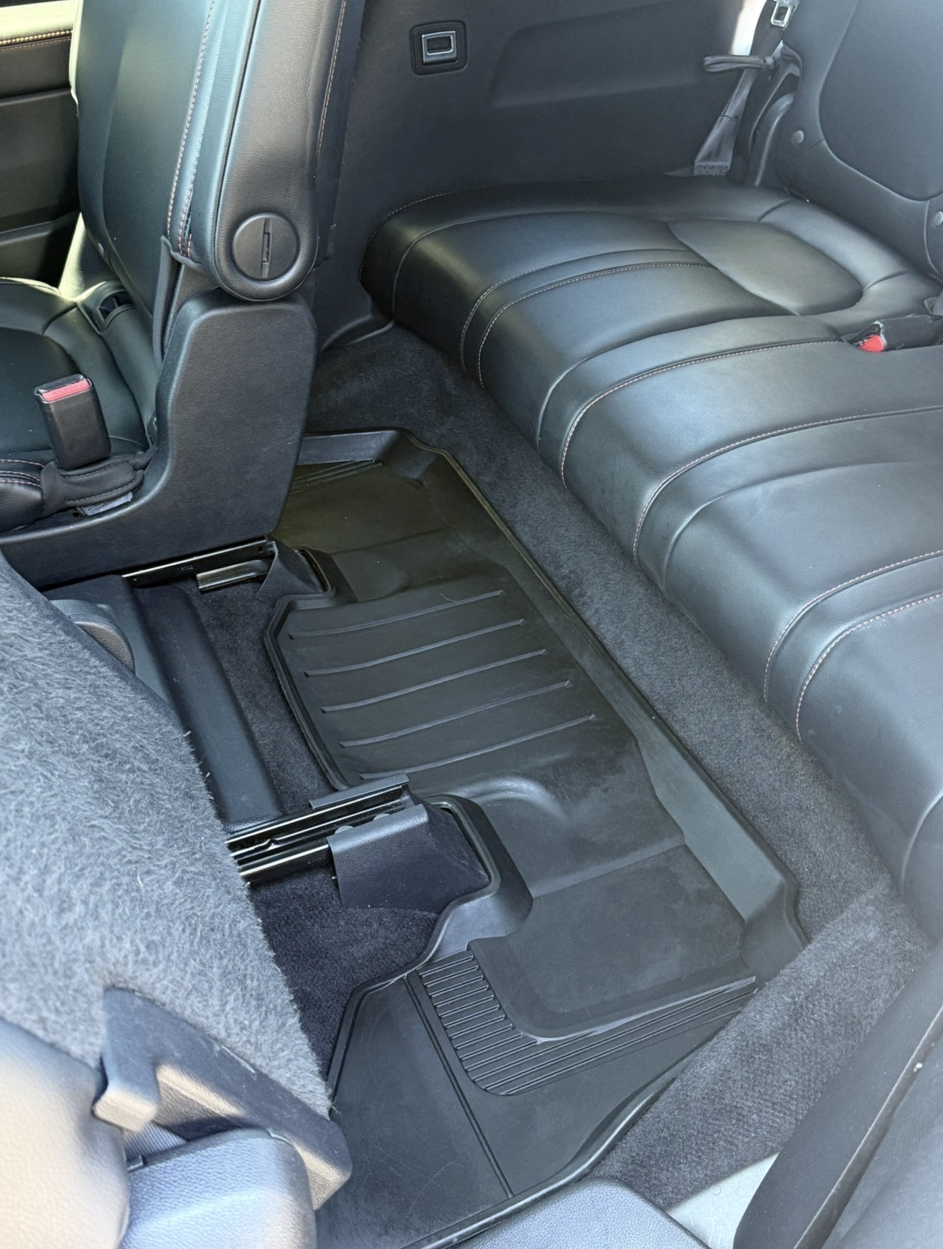 Vehicle rear floor mat fully cleaned after a PRO DTLR reset detail