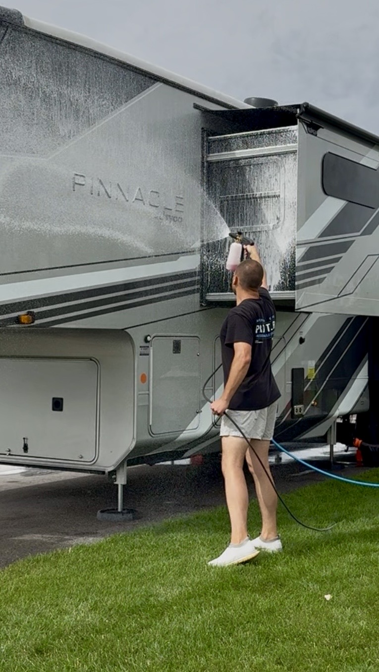PRO DTLR detailer spraying down a Jayco Pinnacle fifth wheel RV