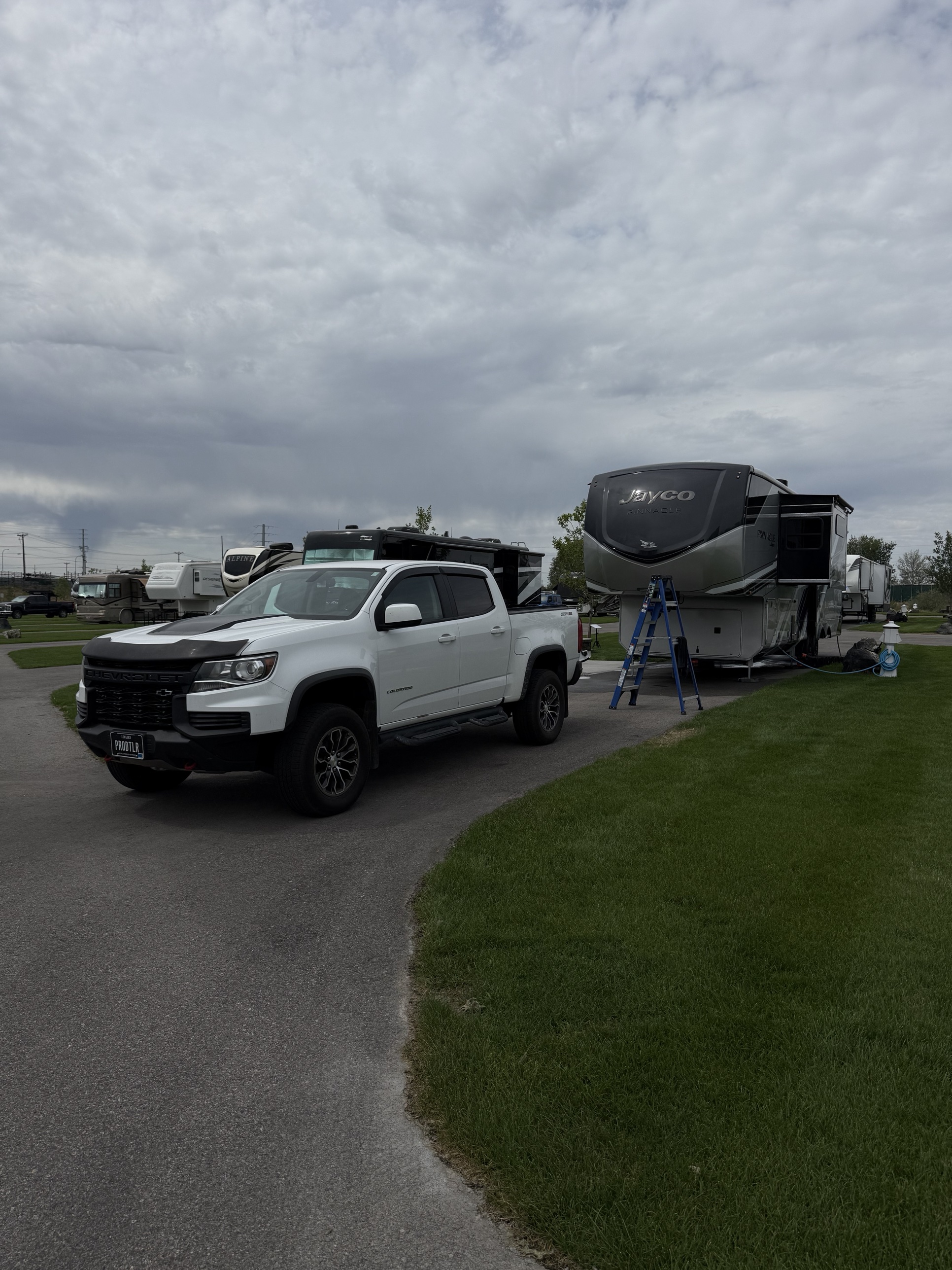 Jayco Pinnacle fifth wheel RV and truck detailed at an Idaho campsite