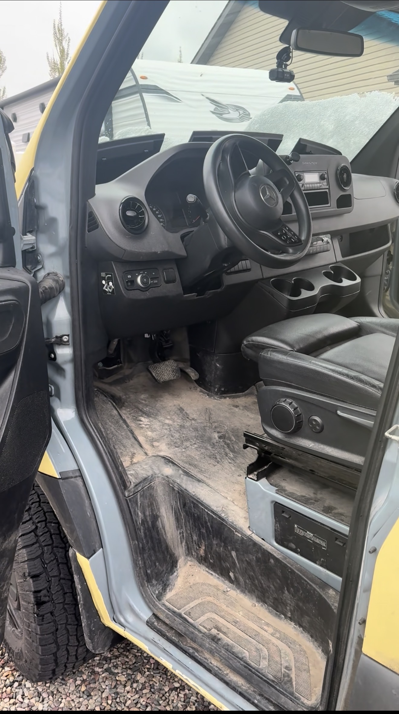 Sprinter van cab and dashboard covered in dust and dirt before a PRO DTLR interior detail