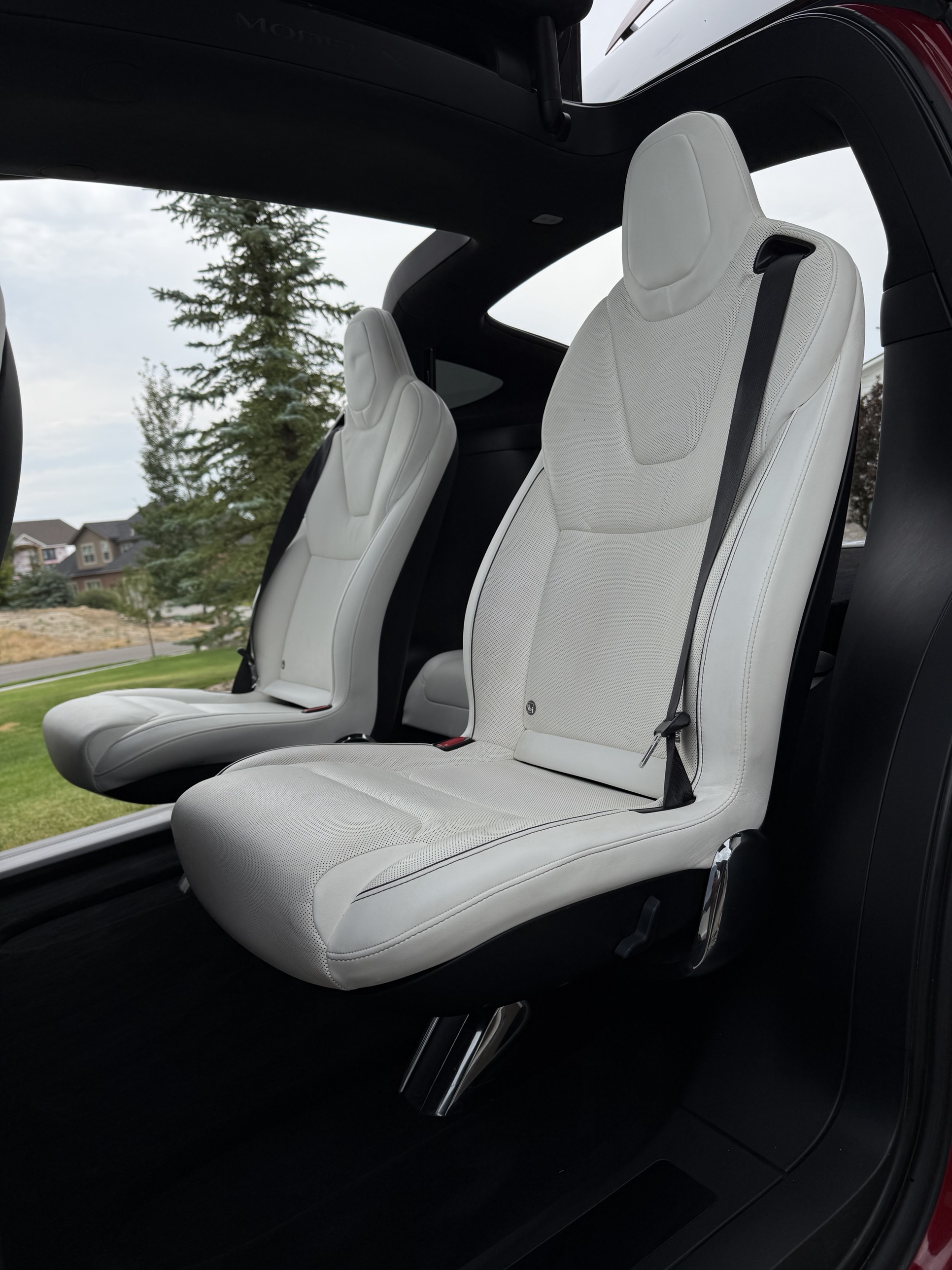 Tesla white leather seats cleaned and conditioned after an interior detail