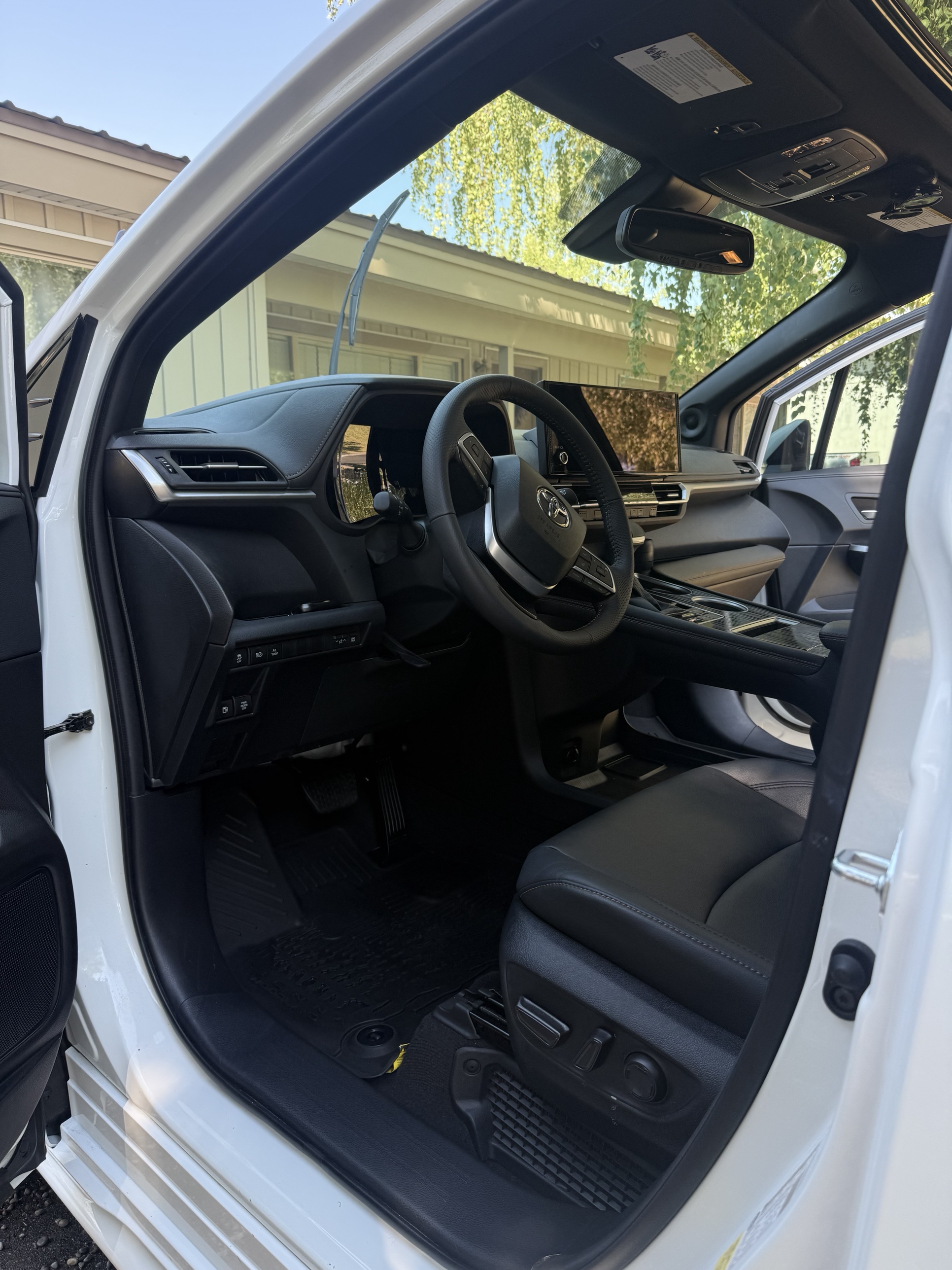Toyota SUV interior with dashboard, steering wheel, and infotainment screen after a mobile detail